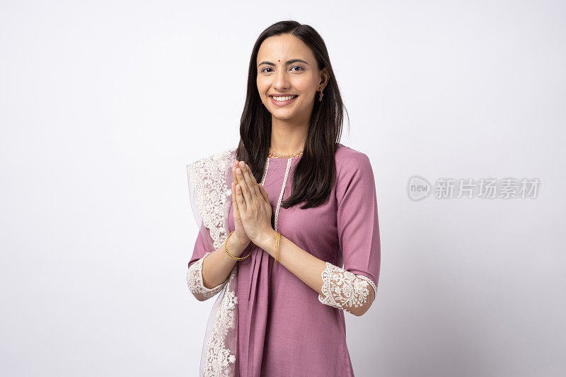 Portrait of Indian young woman waering traditional clothing isolated on white background stock photo